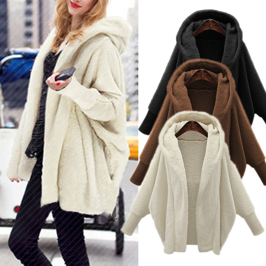 SnowGlam: Winter warm faux fur coat with soft hoodies, lantern sleeves, and loose casual fit for a chic plus-size outerwear option.