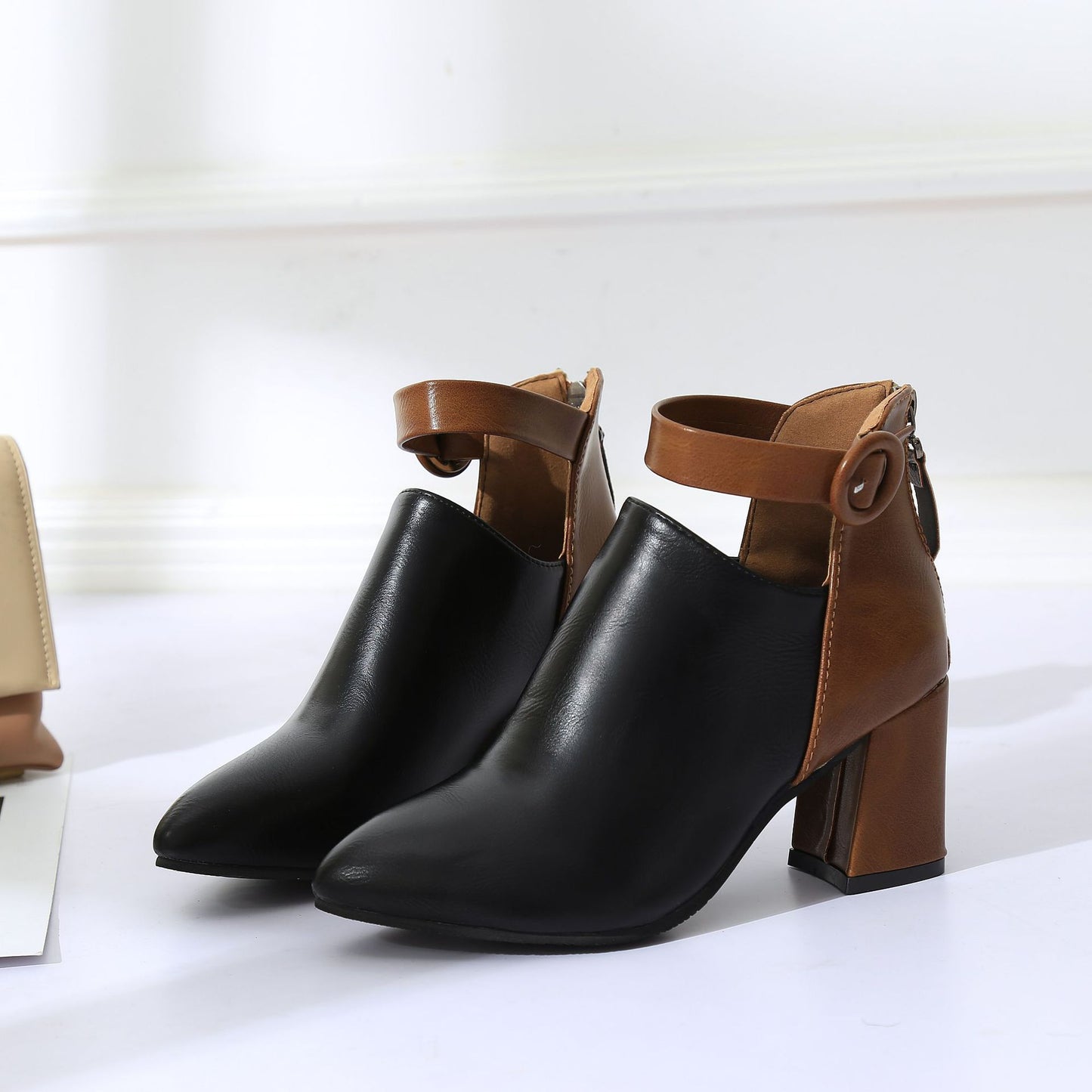 Effortlessly chic, LunaEase's Back-Zipper Ankle Boots combine style and ease for a seamless fashion-forward step.