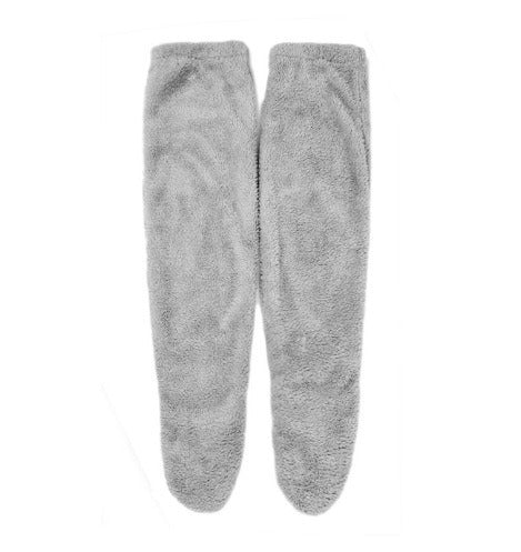 PlushCharm: Indoor plush warmth with long socks, fuzzy over-knee leg warmers, and cozy stocking slippers for winter comfort.