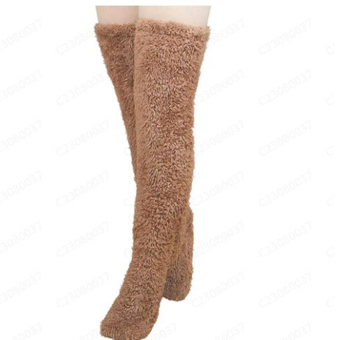 PlushCharm: Indoor plush warmth with long socks, fuzzy over-knee leg warmers, and cozy stocking slippers for winter comfort.