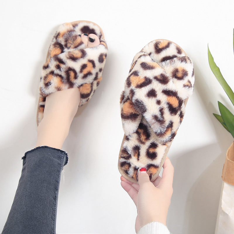 LeopardLuxe: Cross-strap fuzzy slippers with plush comfort, perfect for flat bedroom style and women's coziness.