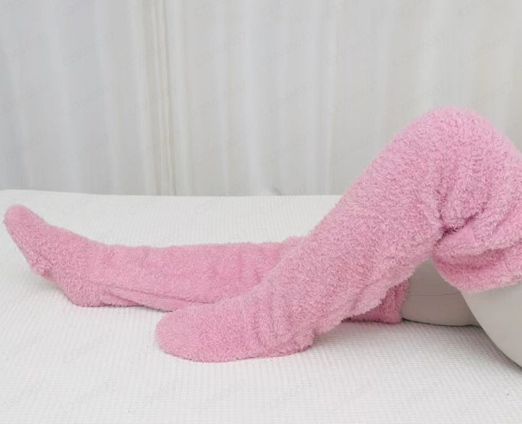 PlushCharm: Indoor plush warmth with long socks, fuzzy over-knee leg warmers, and cozy stocking slippers for winter comfort.