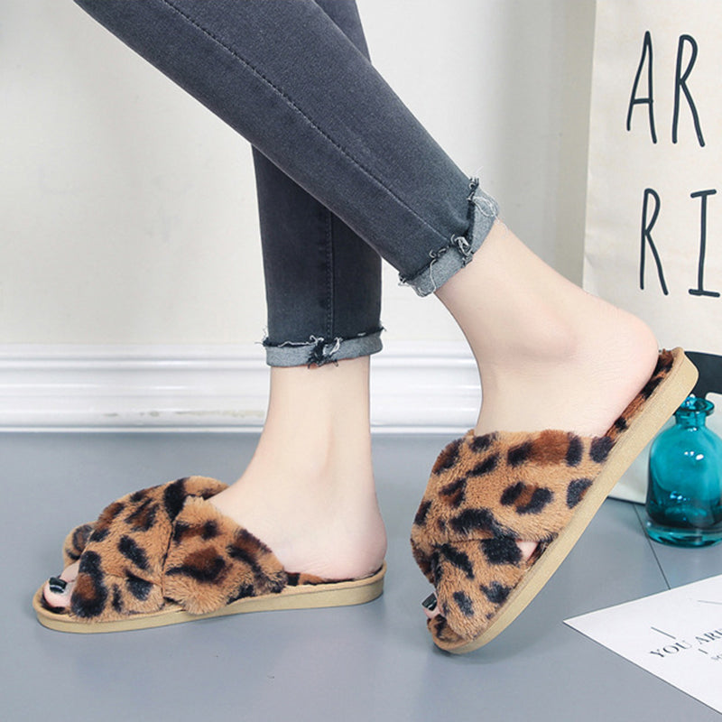 LeopardLuxe: Cross-strap fuzzy slippers with plush comfort, perfect for flat bedroom style and women's coziness.