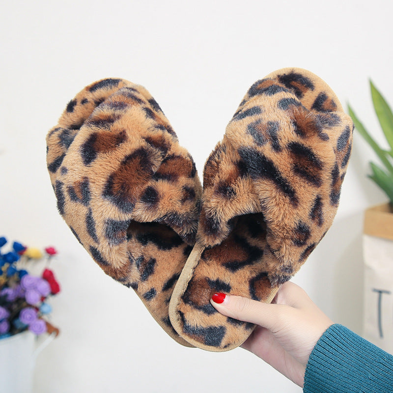 LeopardLuxe: Cross-strap fuzzy slippers with plush comfort, perfect for flat bedroom style and women's coziness.