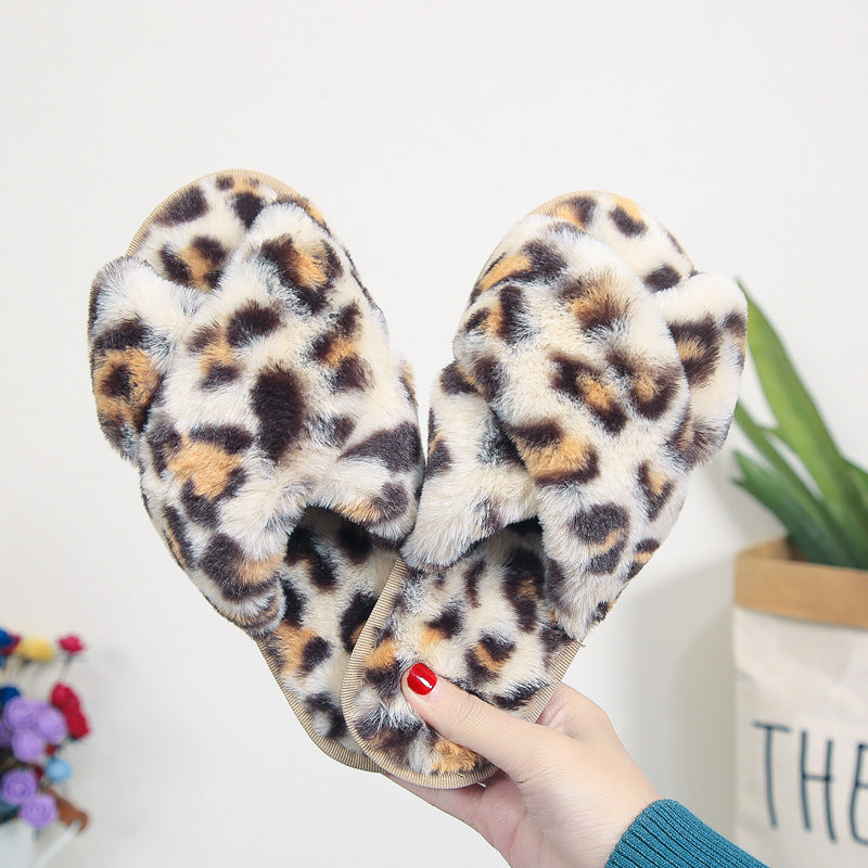 LeopardLuxe: Cross-strap fuzzy slippers with plush comfort, perfect for flat bedroom style and women's coziness.