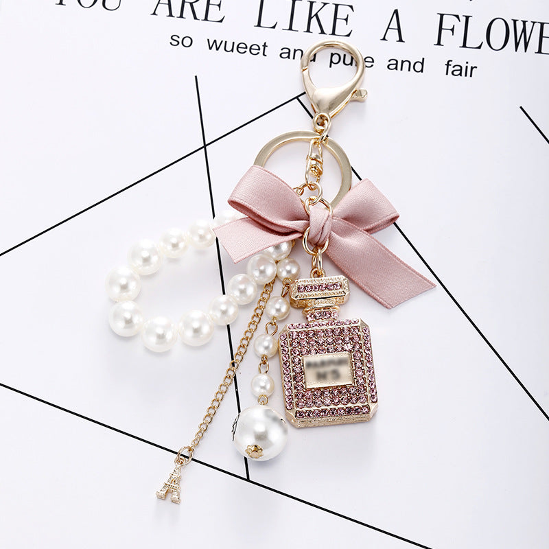 Essence Elysium: Creative Crystal Perfume Bottle Rhinestone Keychain.