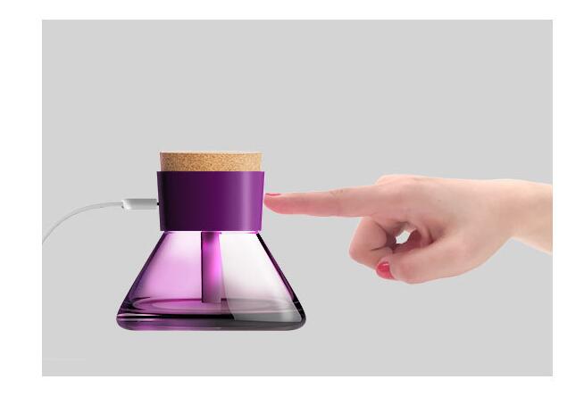 Essence Elysium presents: Perfume Bottle USB Spray Humidifier.